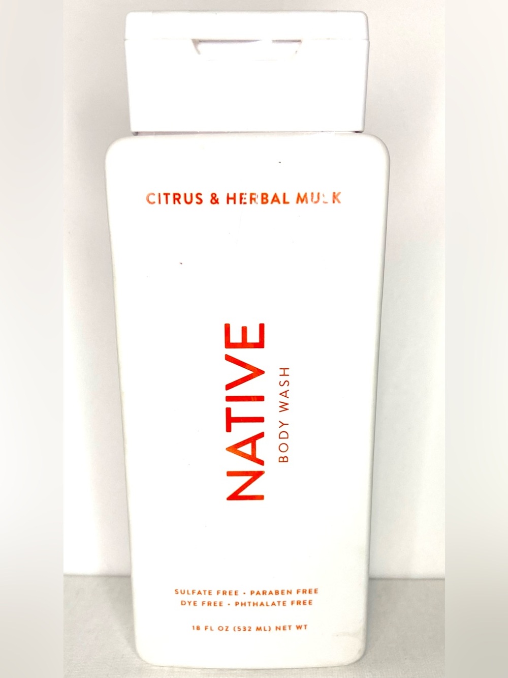 Native Citrus & Herbal Musk Body Wash — White with Orange Text